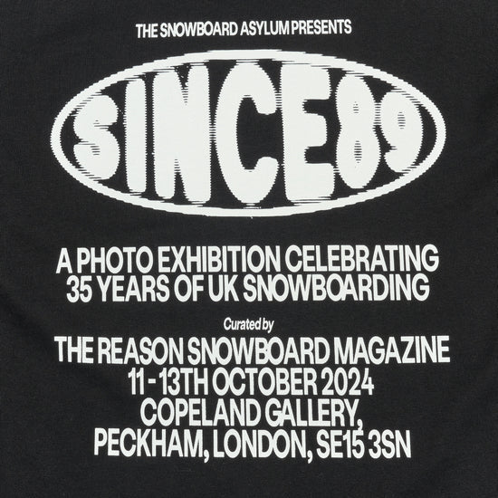 Black t-shirt with white text about a snowboarding exhibition.