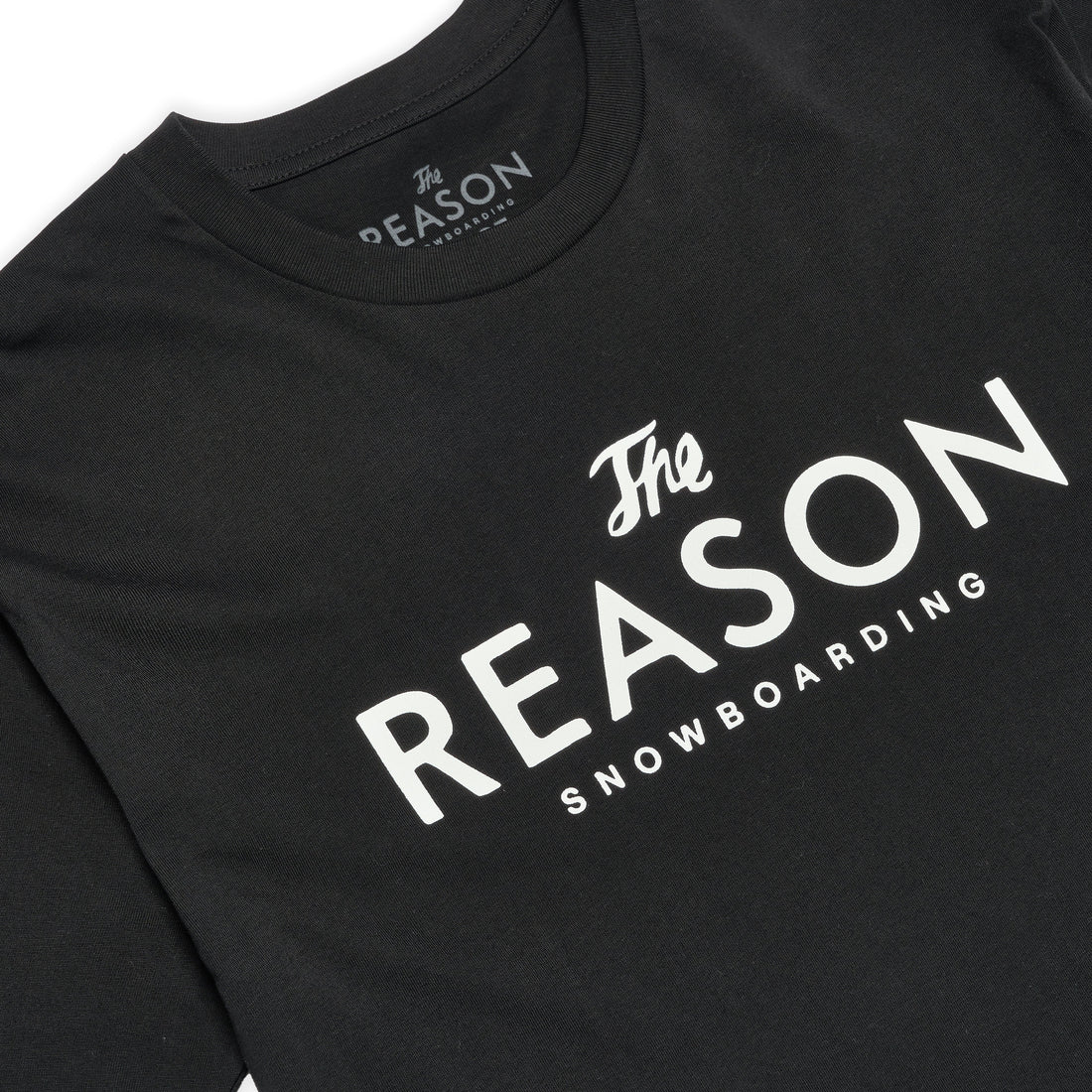 Black t-shirt with 'The Reason Snowboarding' text on a white background