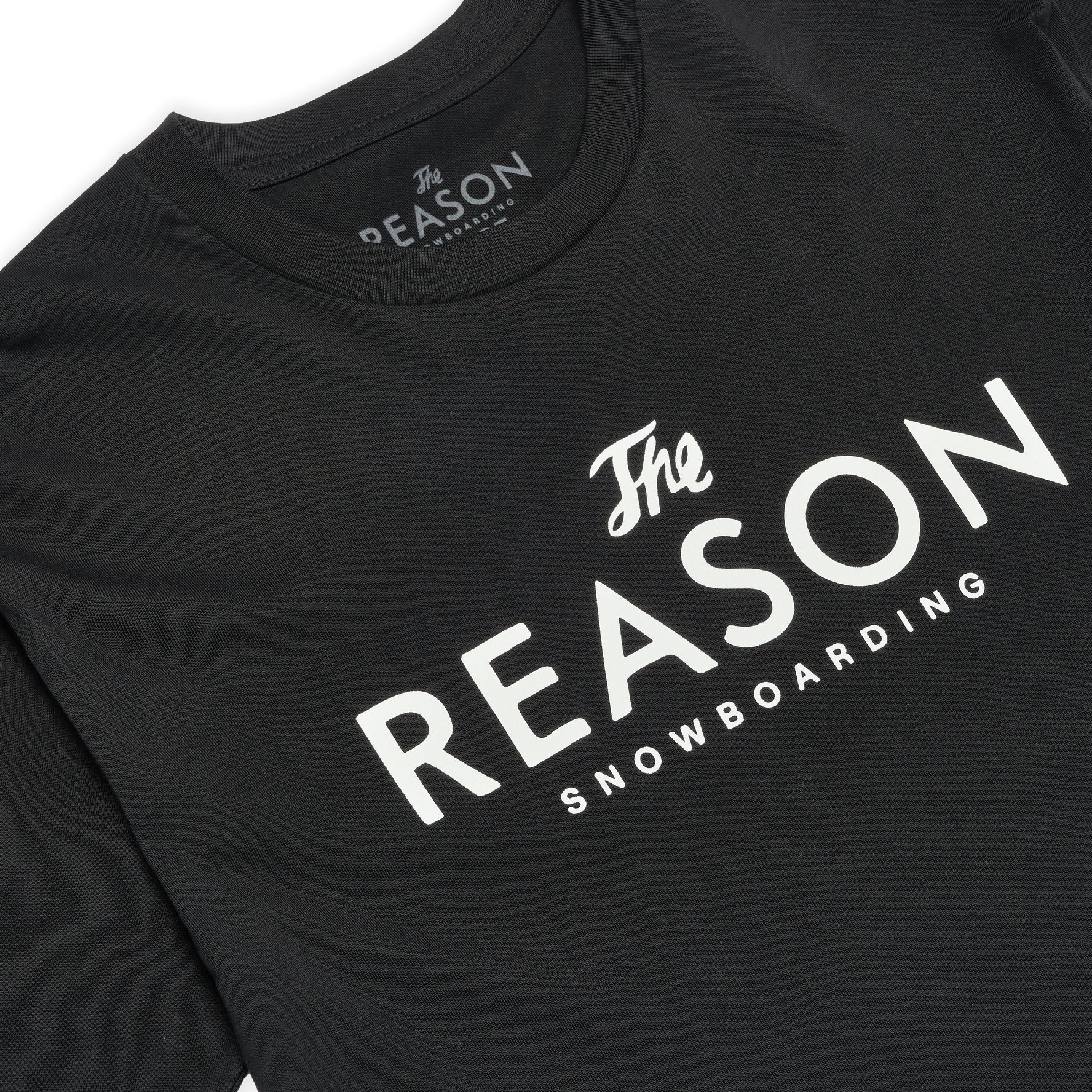 Black t-shirt with 'The Reason Snowboarding' text on a white background